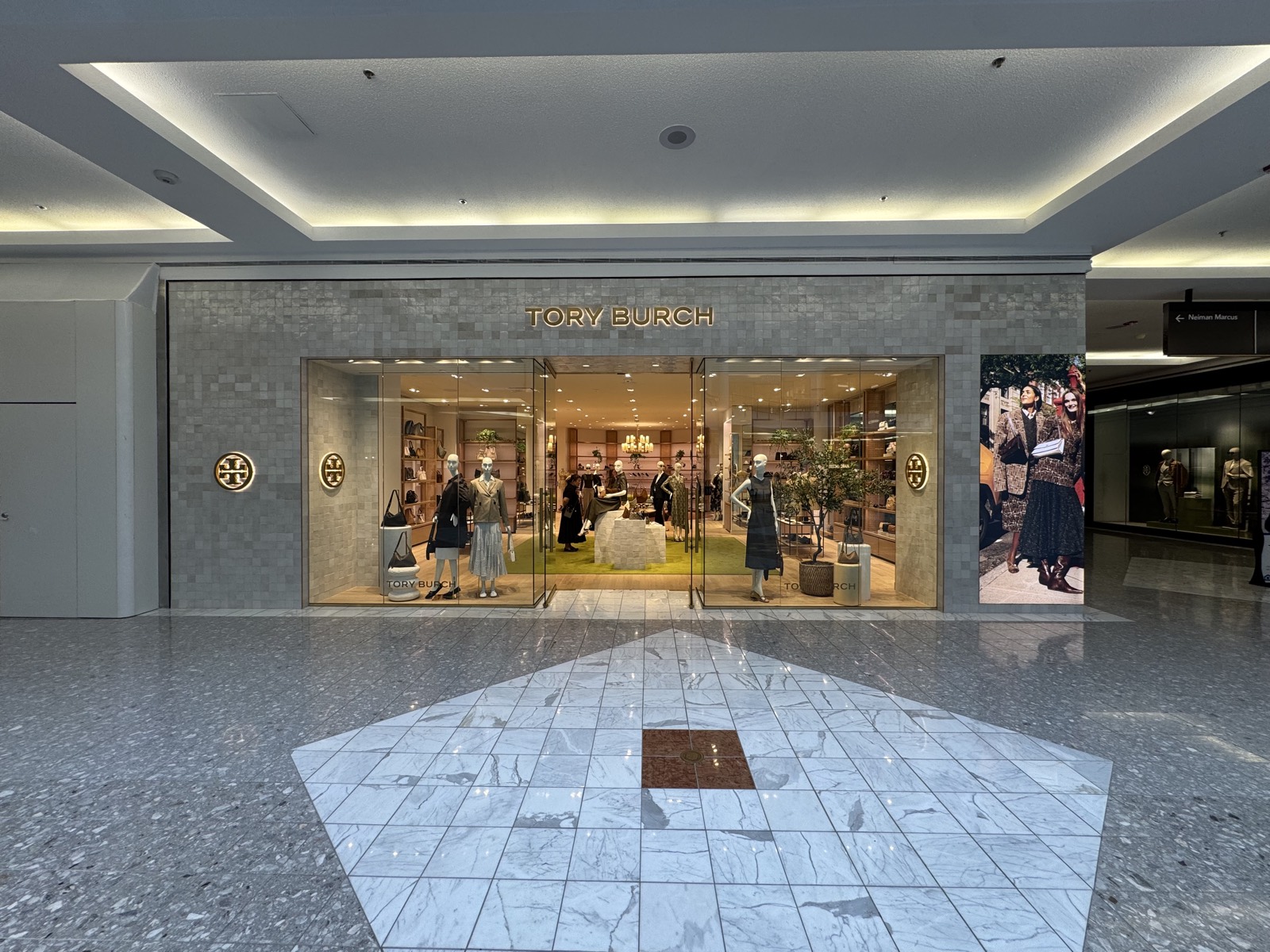 Tory Burch luxury retail storefront interior signage