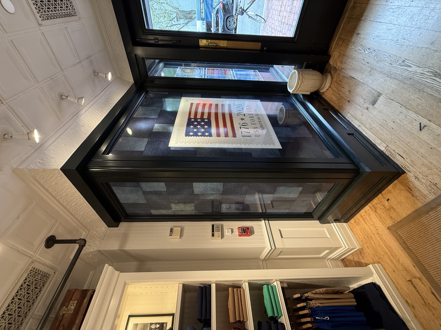 Interior window display with large printed campaign graphic