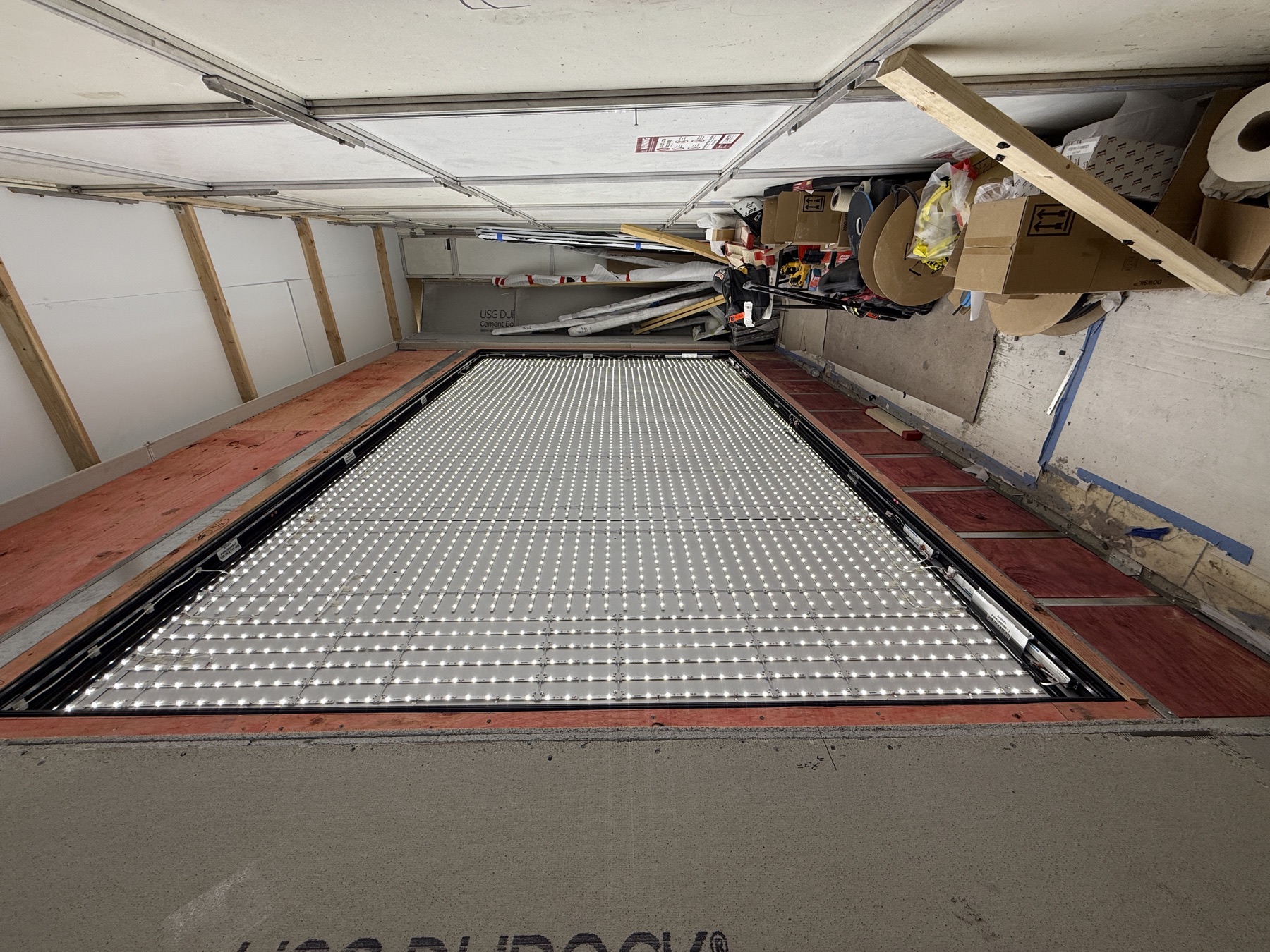 LED module grid wired inside a large lightbox cabinet