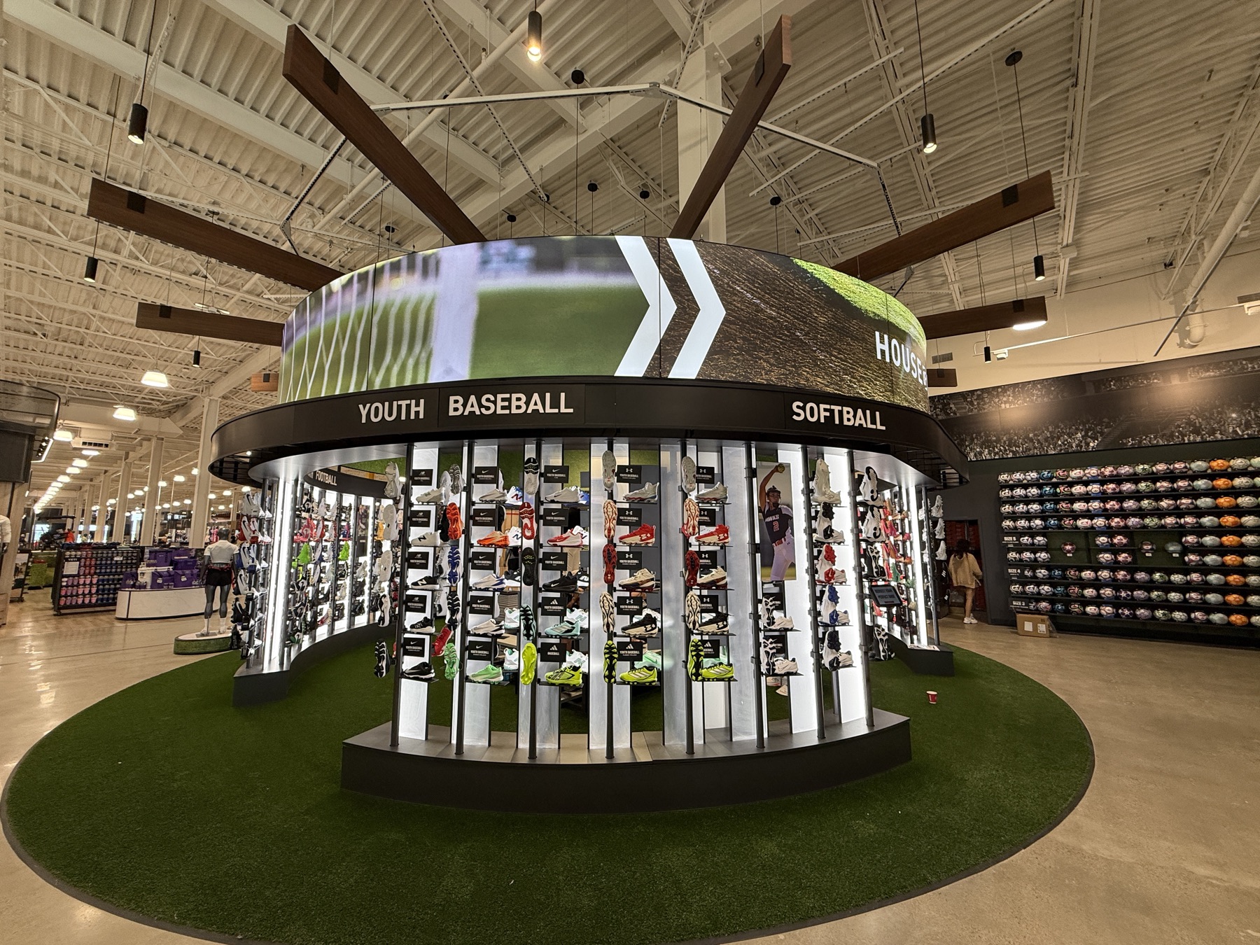 Circular LED display ring installed above a retail merchandising area