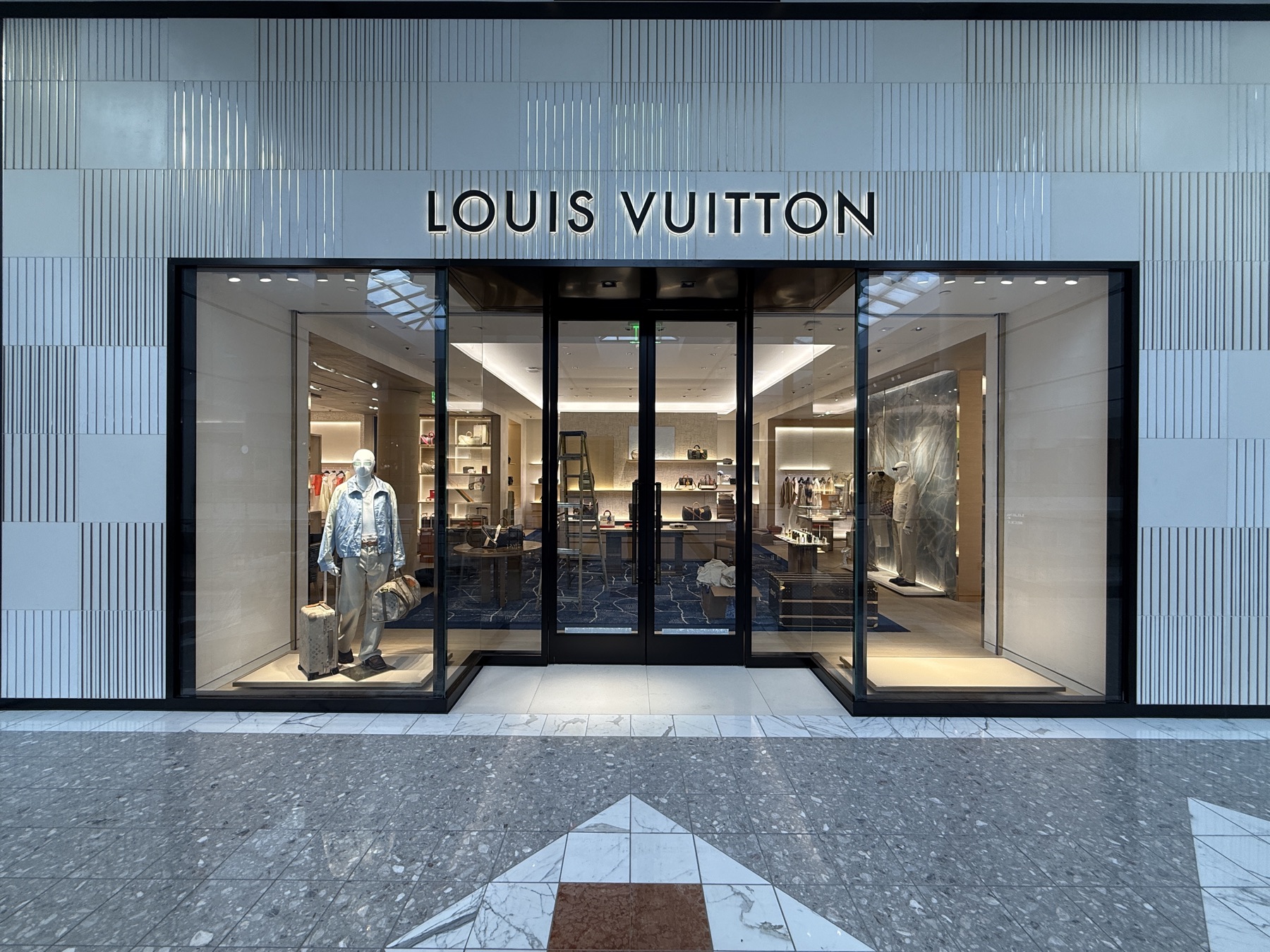 Halo-lit dimensional letters installed above a mall storefront