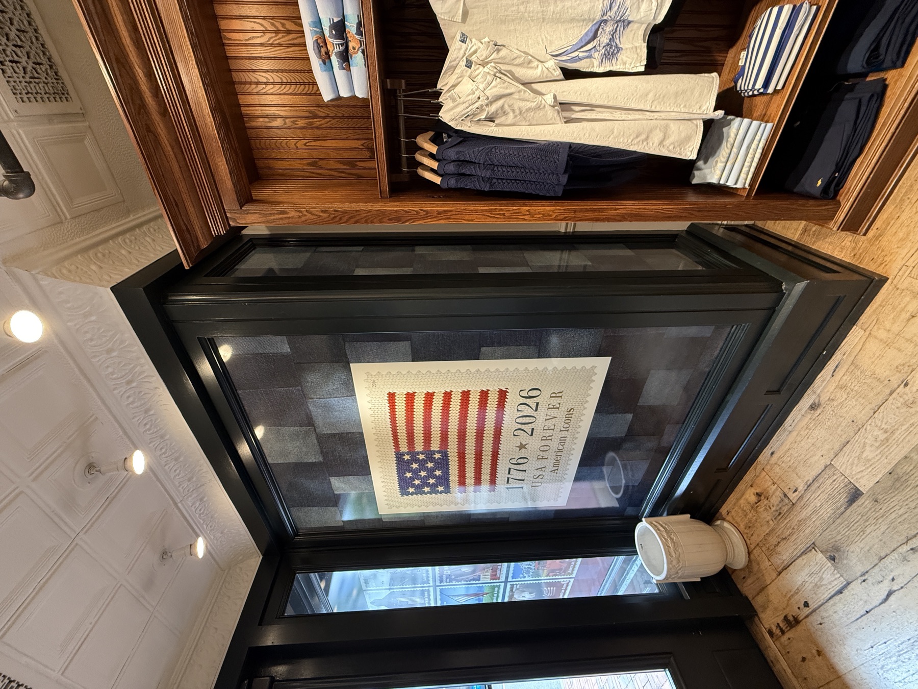 Track-lit interior display with backlit campaign graphic