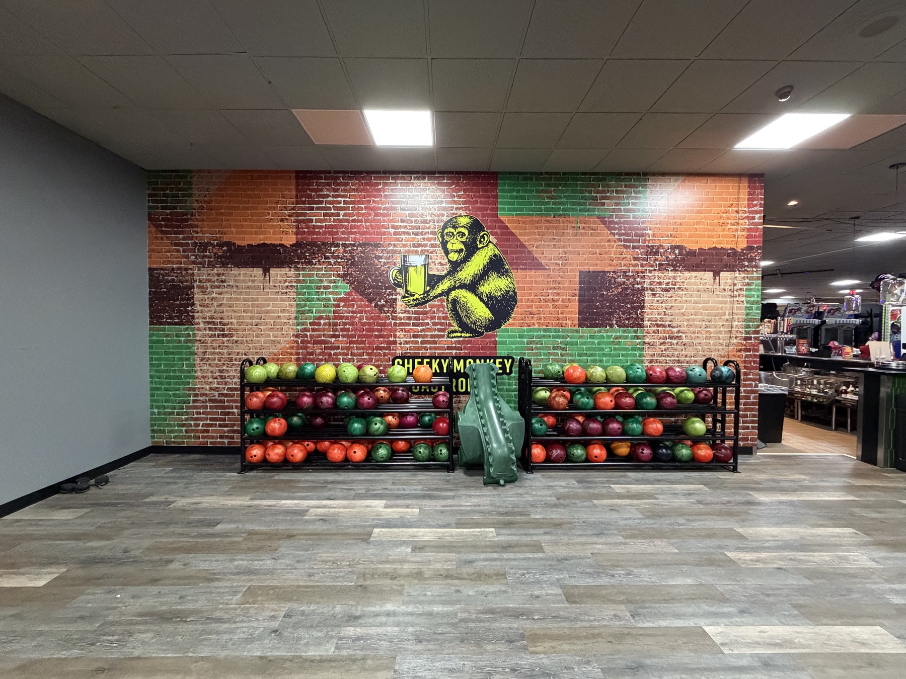 Colorful printed wall mural at a venue dining area