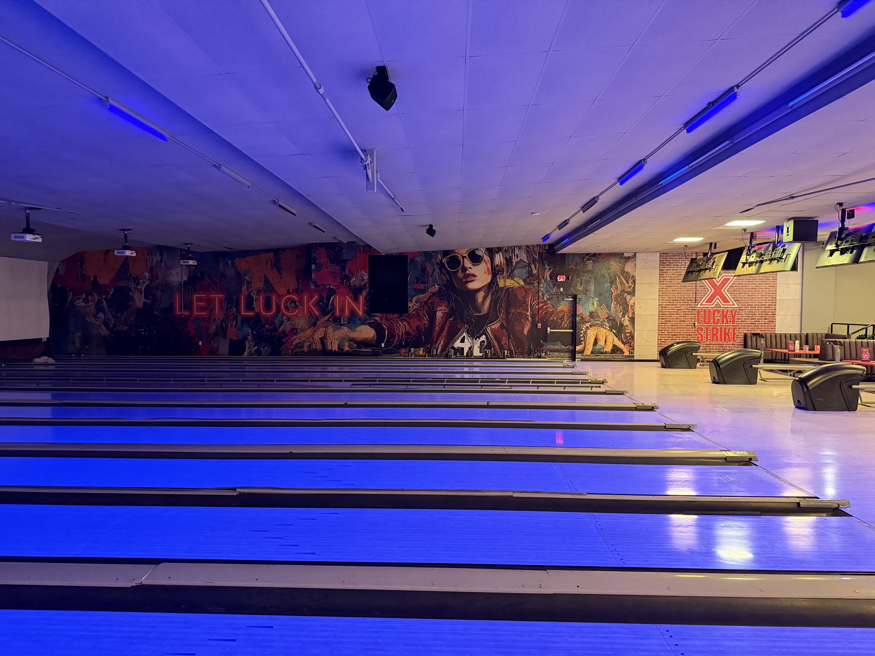 Printed wall mural and brand graphics installed at an entertainment venue