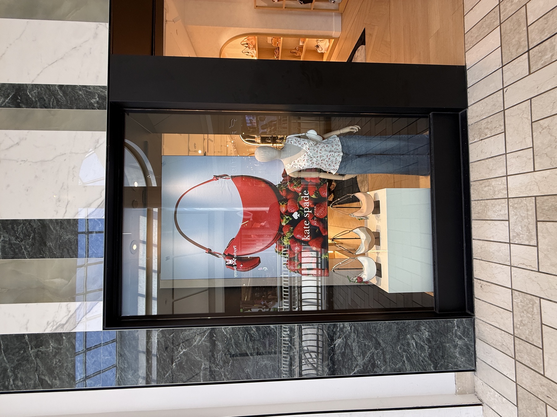 Seasonal campaign graphic panel in a retail display window