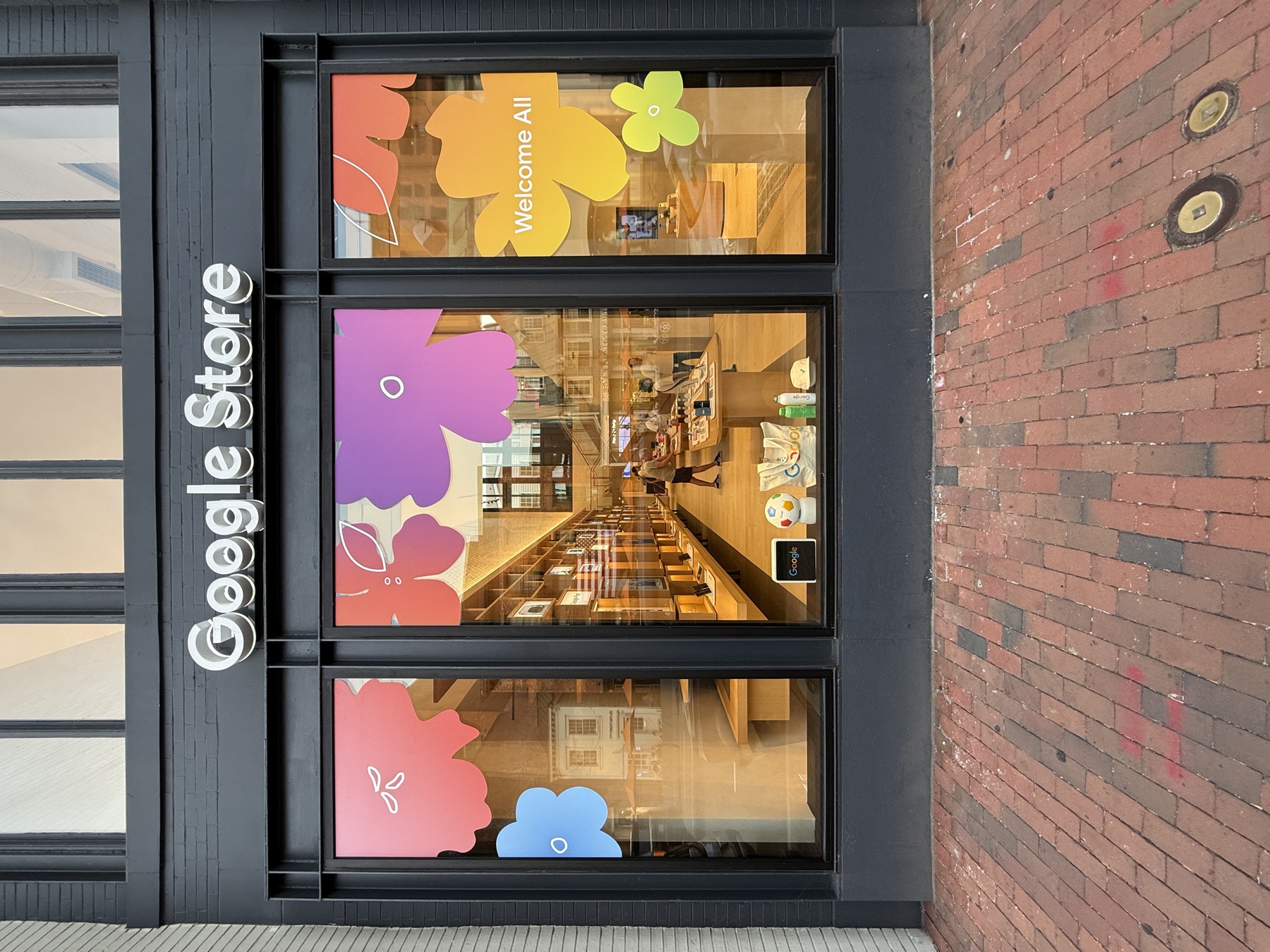 Full-window printed vinyl graphics on a retail storefront