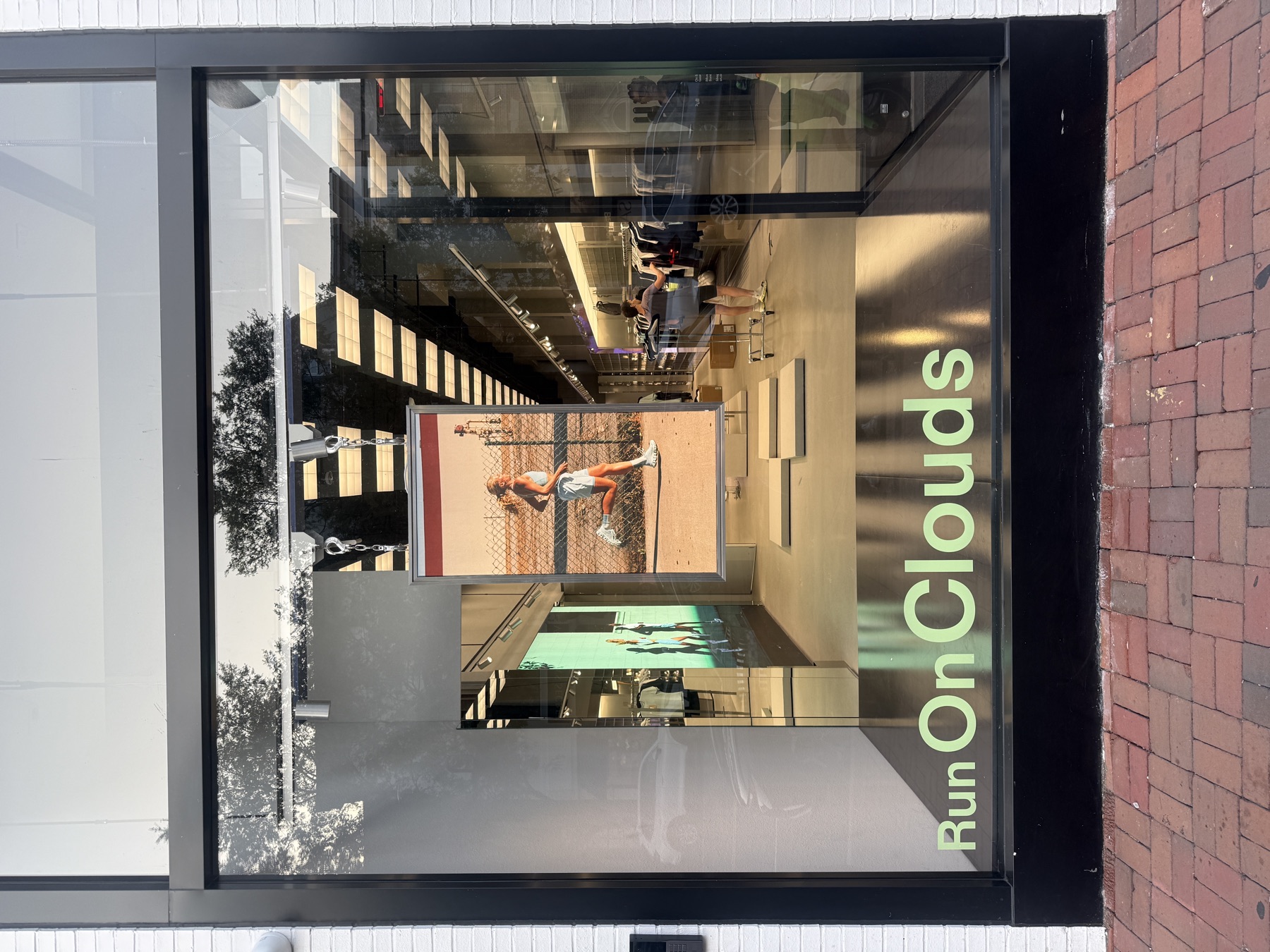 Storefront window lettering installed for a product campaign